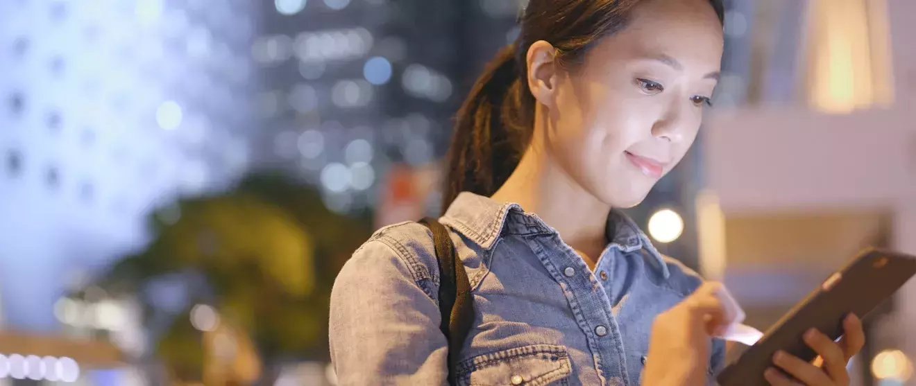 Person looking at the Notified platform on their phone.